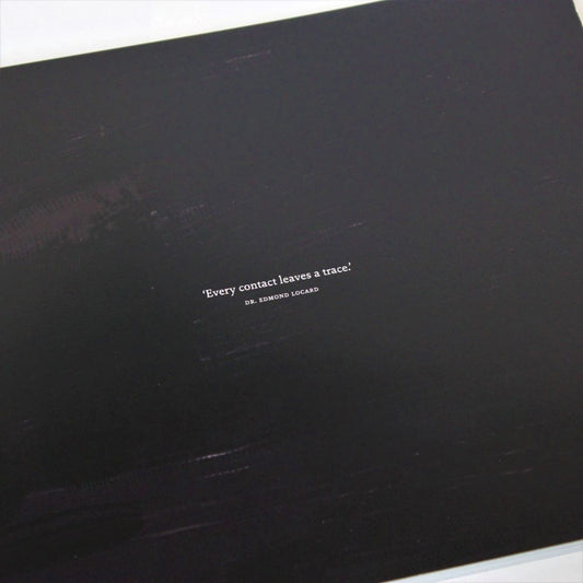 Black surface with a short quote printed in white text.