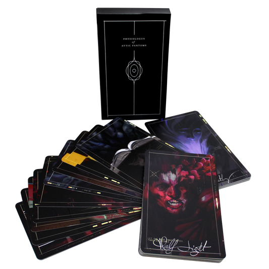 Deck of dark-themed tarot or oracle cards with artistic imagery spread out from its box.