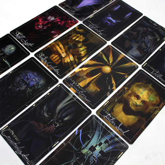 Collection of dark, mystical-looking tarot or oracle cards arranged in a grid pattern.